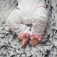 White scrunch leggings with pink bows on baby girl