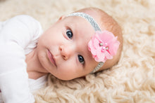 Baby girl wearing a pink floral headband