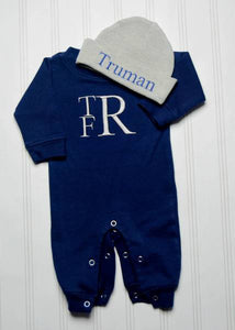 Full view of monogrammed hat and bodysuit in navy blue and gray